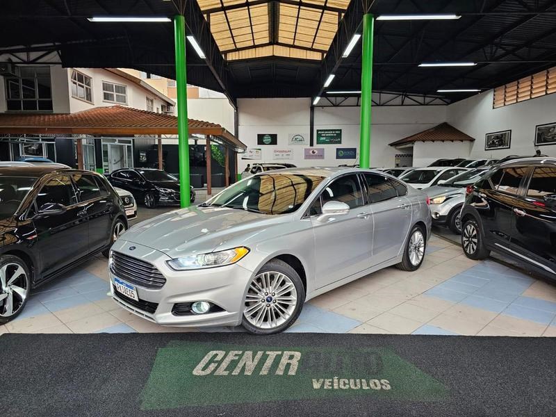 //www.autoline.com.br/carro/ford/fusion-20-gtdi-titanium-fwd-16v-gasolina-4p-turbo-au/2015/cambe-pr/25027365