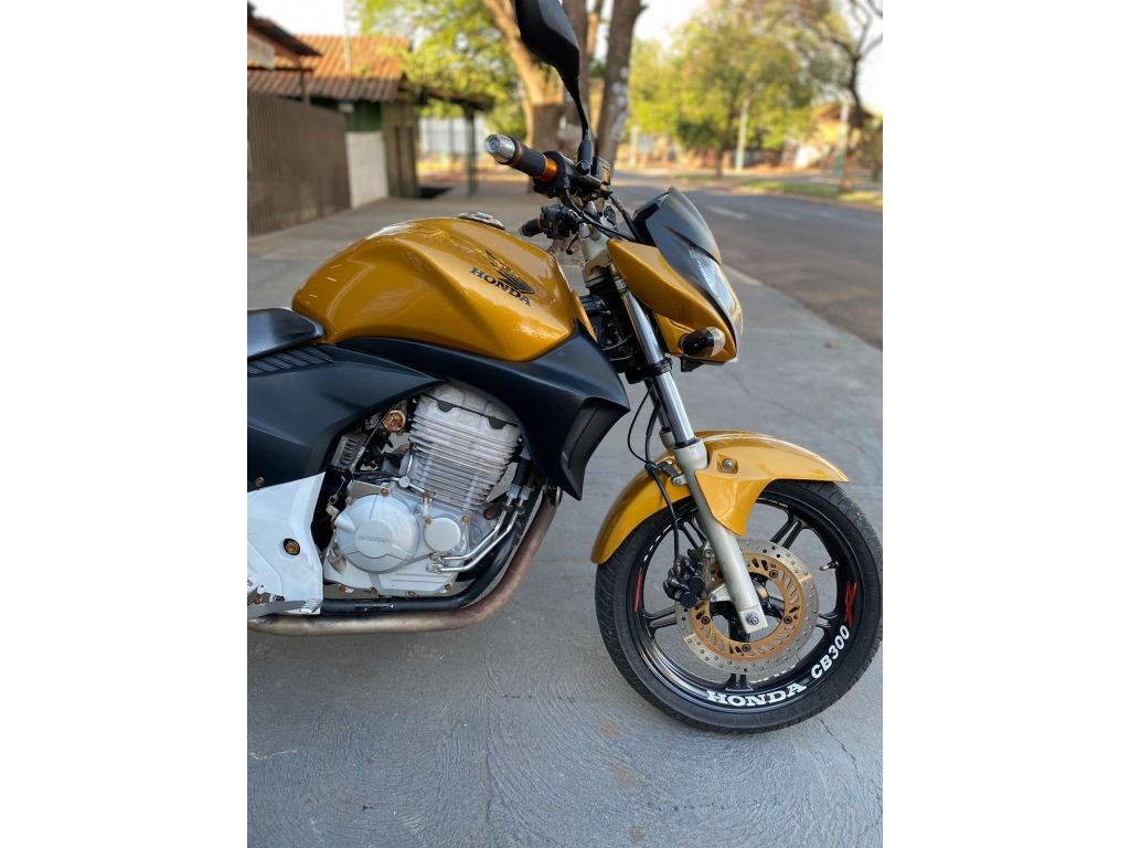 //www.autoline.com.br/moto/honda/cb-300-r-flexstd-etagas-mec-basico/2010/nova-londrina-pr/24808650