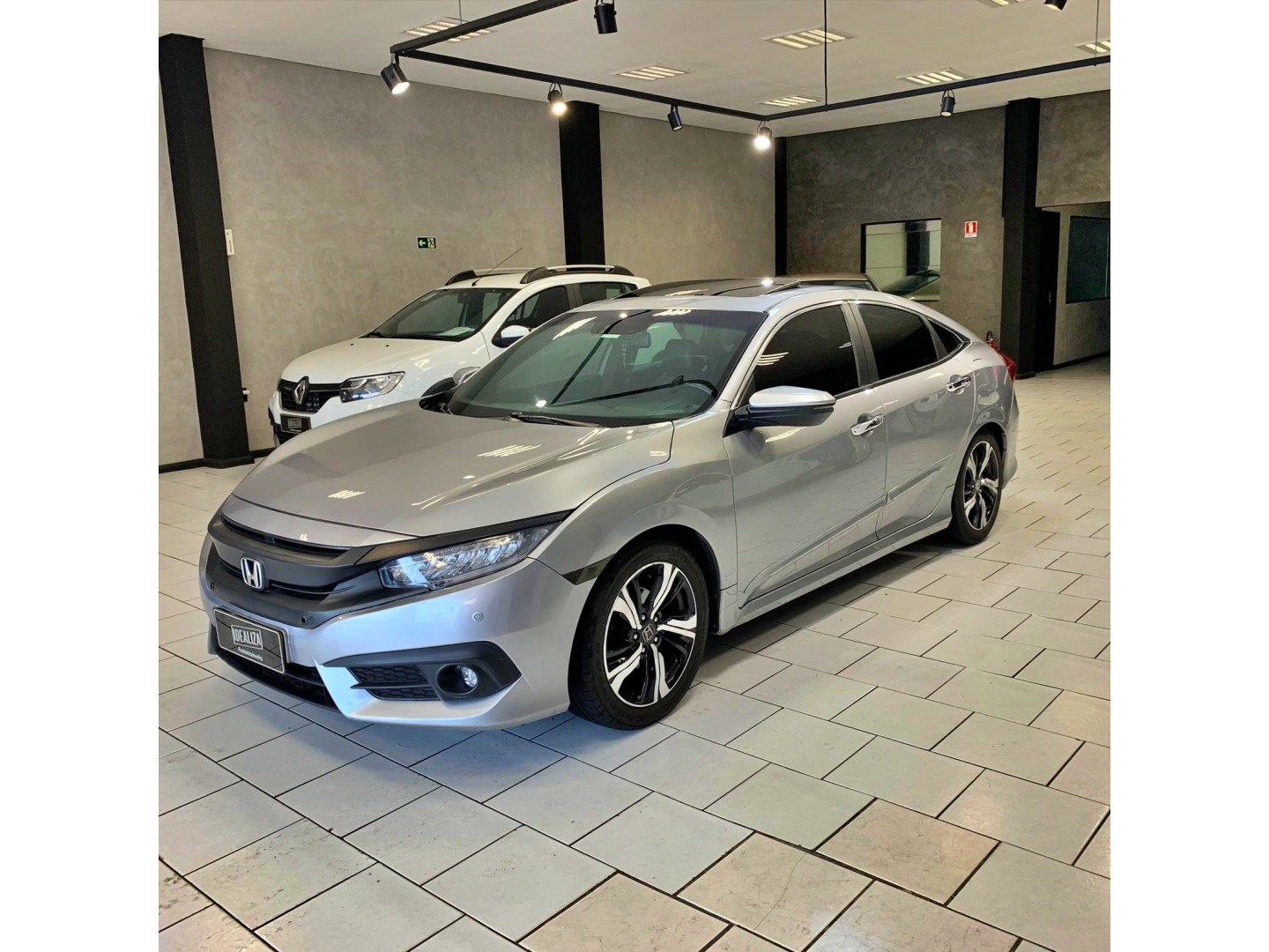 //www.autoline.com.br/carro/honda/civic-15-touring-16v-gasolina-4p-cvt/2017/porto-alegre-rs/23614507