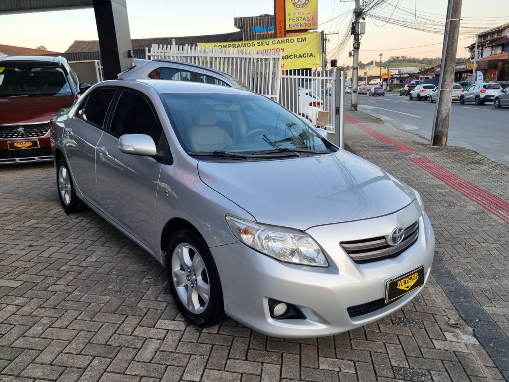 //www.autoline.com.br/carro/toyota/corolla-18-xei-16v-flex-4p-automatico/2010/joinville-sc/24742556