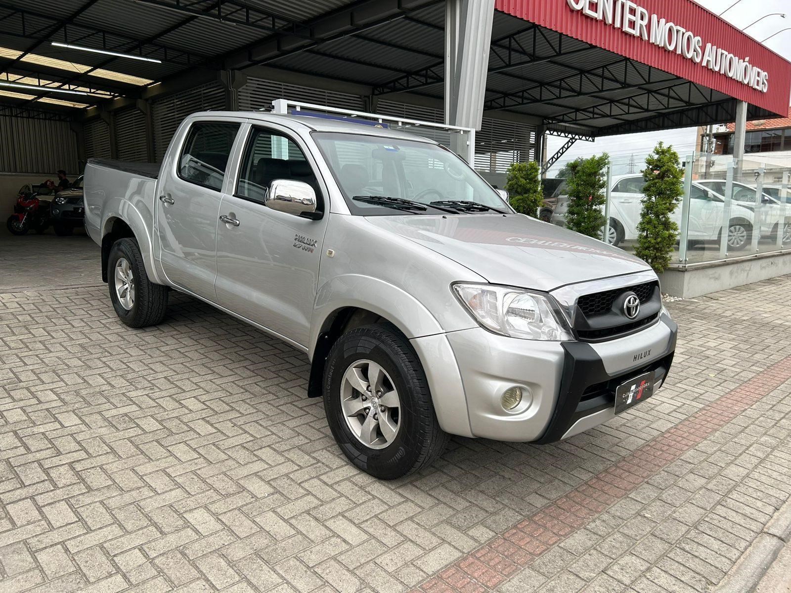 //www.autoline.com.br/carro/toyota/hilux-27-cd-sr-16v-gasolina-4p-manual/2009/capivari-de-baixo-sc/23814369