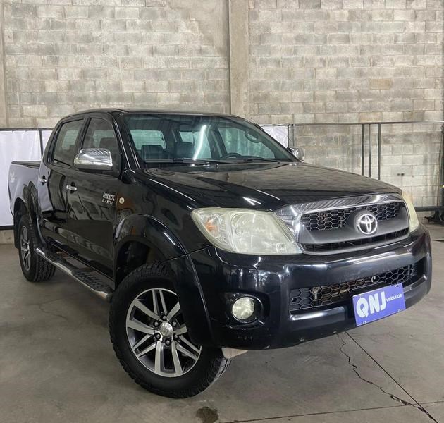 //www.autoline.com.br/carro/toyota/hilux-27-cd-sr-16v-gasolina-4p-manual/2010/brasilia-df/24597160