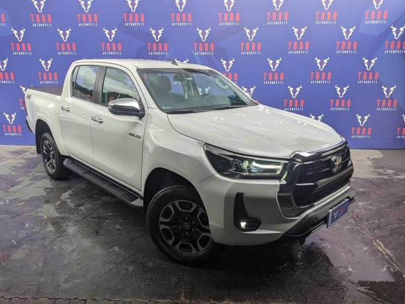 //www.autoline.com.br/carro/toyota/hilux-28-cd-srx-16v-diesel-4p-4x4-turbo-automatico/2021/brasilia-df/24633008