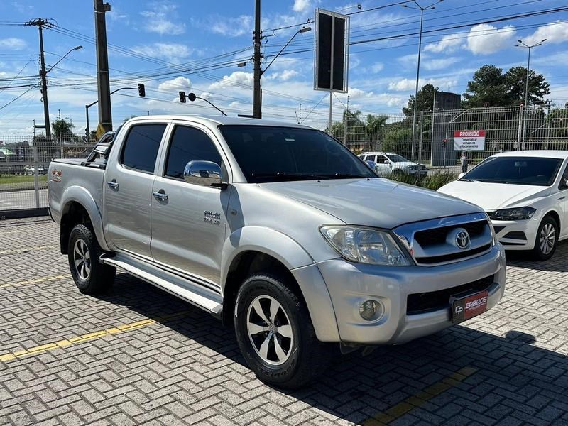 //www.autoline.com.br/carro/toyota/hilux-27-cd-sr-16v-gasolina-4p-manual/2009/curitiba-pr/24995375