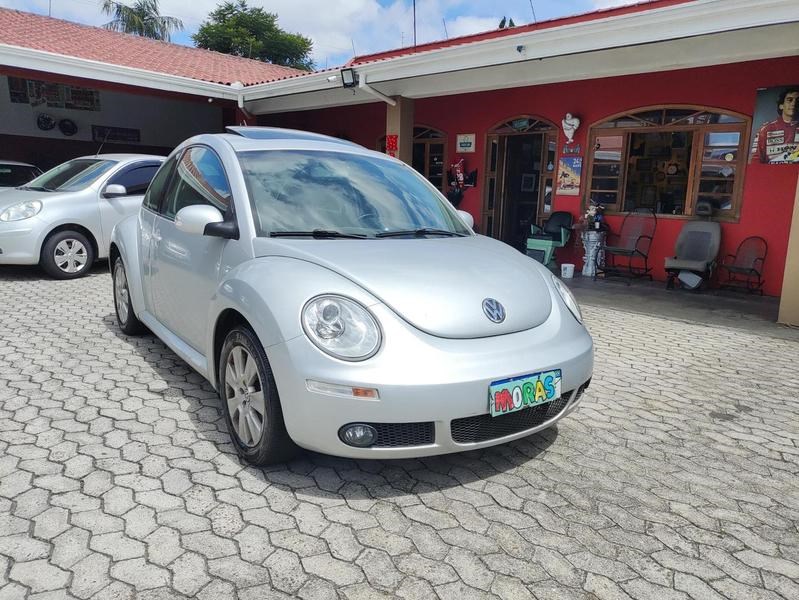 //www.autoline.com.br/carro/volkswagen/new-beetle-20-l-8v-gasolina-2p-automatico/2008/curitiba-pr/23553482