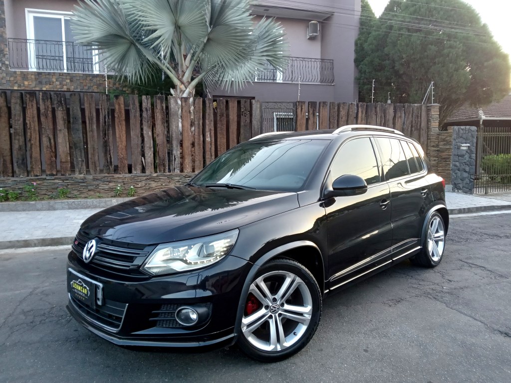 //www.autoline.com.br/carro/volkswagen/tiguan-20-tsi-16v-gasolina-4p-4x4-turbo-automatico/2013/joinville-sc/24165523